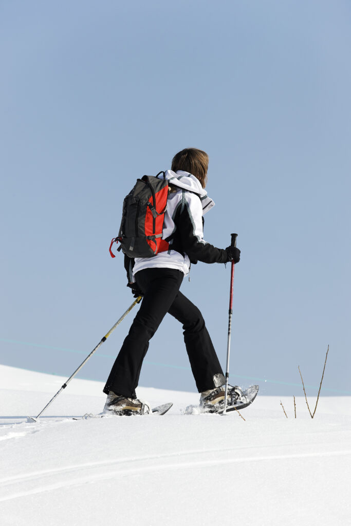 on the snow with rackets